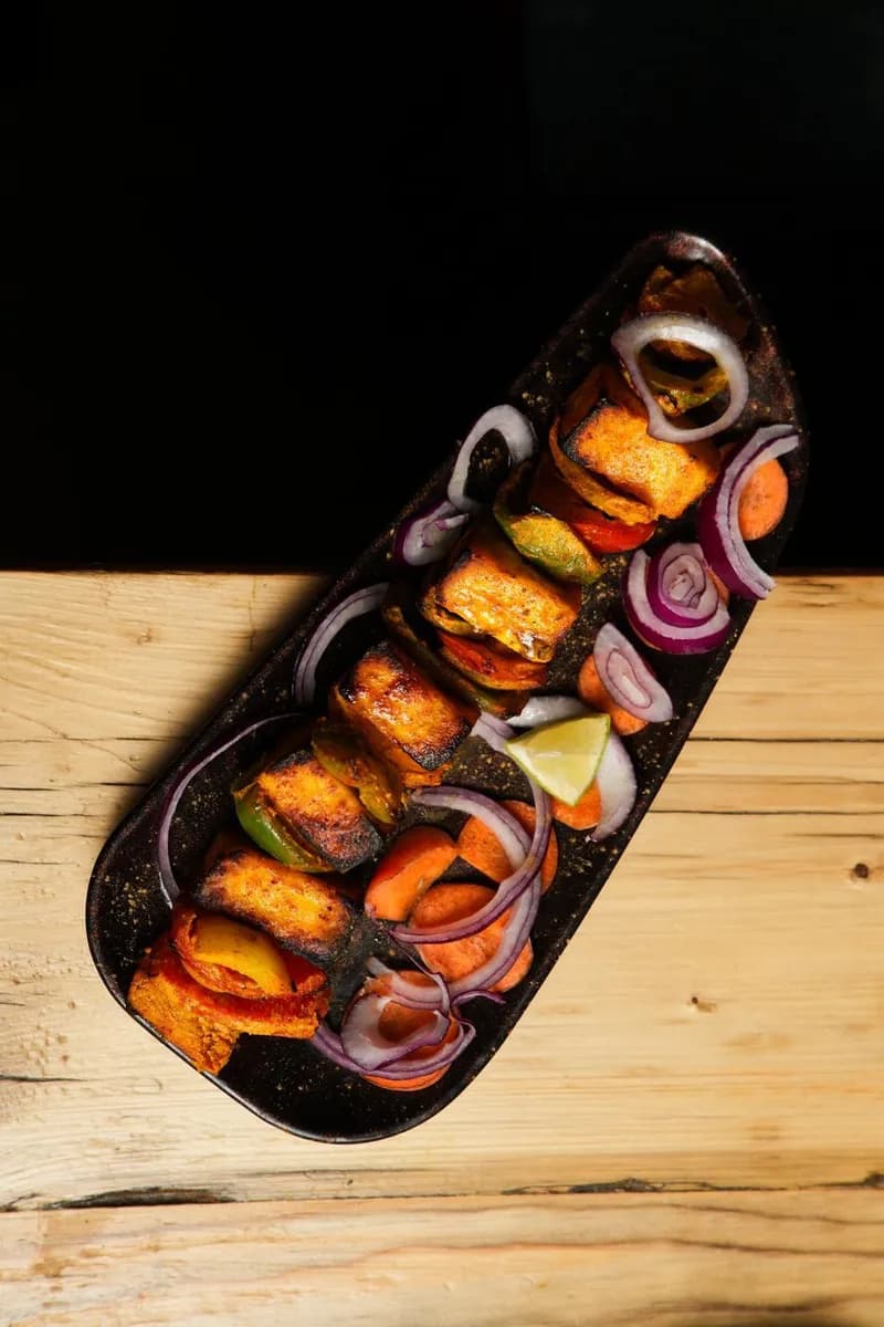 Tandoori Paneer - Marinated in yogurt and spices, cooked in tandoor